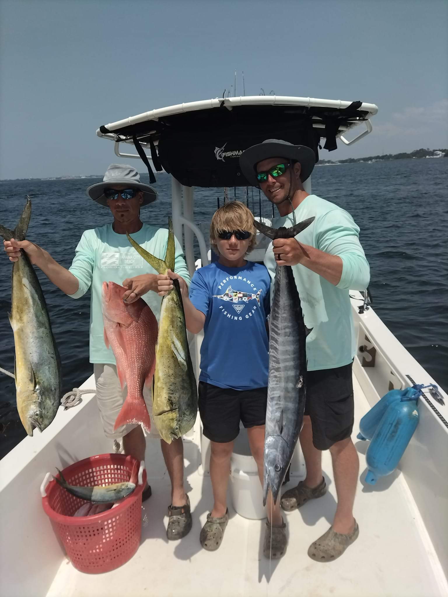 Happy family enjoying a day of fishing charters in Panama City Beach, FL